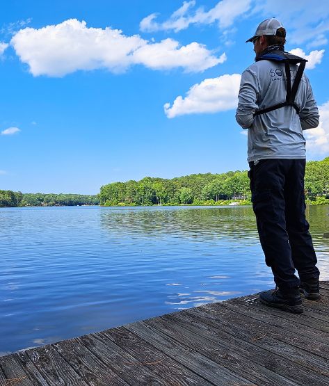 SOLitude Lake Aquatic Expert looking out at lake from the dock