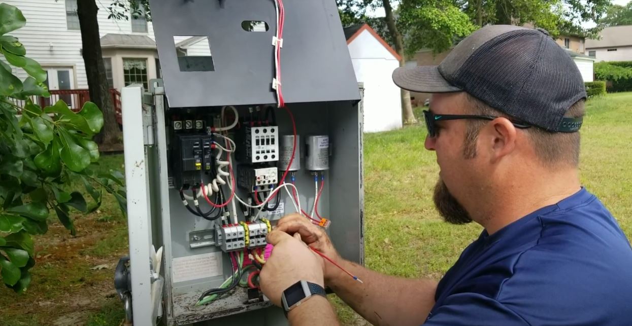 fountains and aeration - colleague installing floating fountain and fixing floating fountains - fountain repair - oils and seals - regulatory compliance for ponds