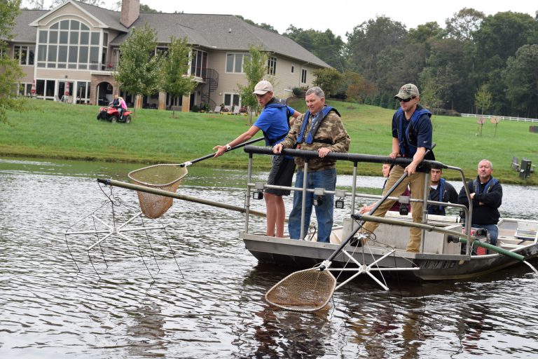 electrofishing-fisheries-managementParagraph 3 - _electrofishing is a management tool - netting fish - scooping fish out of lake - caring for pond fish - fish population management - fish health management