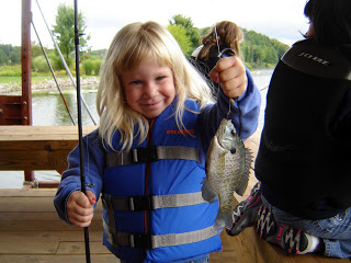 girl shows off bluegill catch
