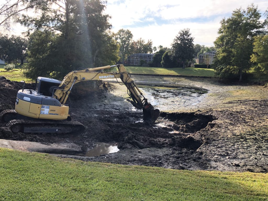 dredging a lake - dredging a pond - sediment removal - removing invasive species and pond weeds