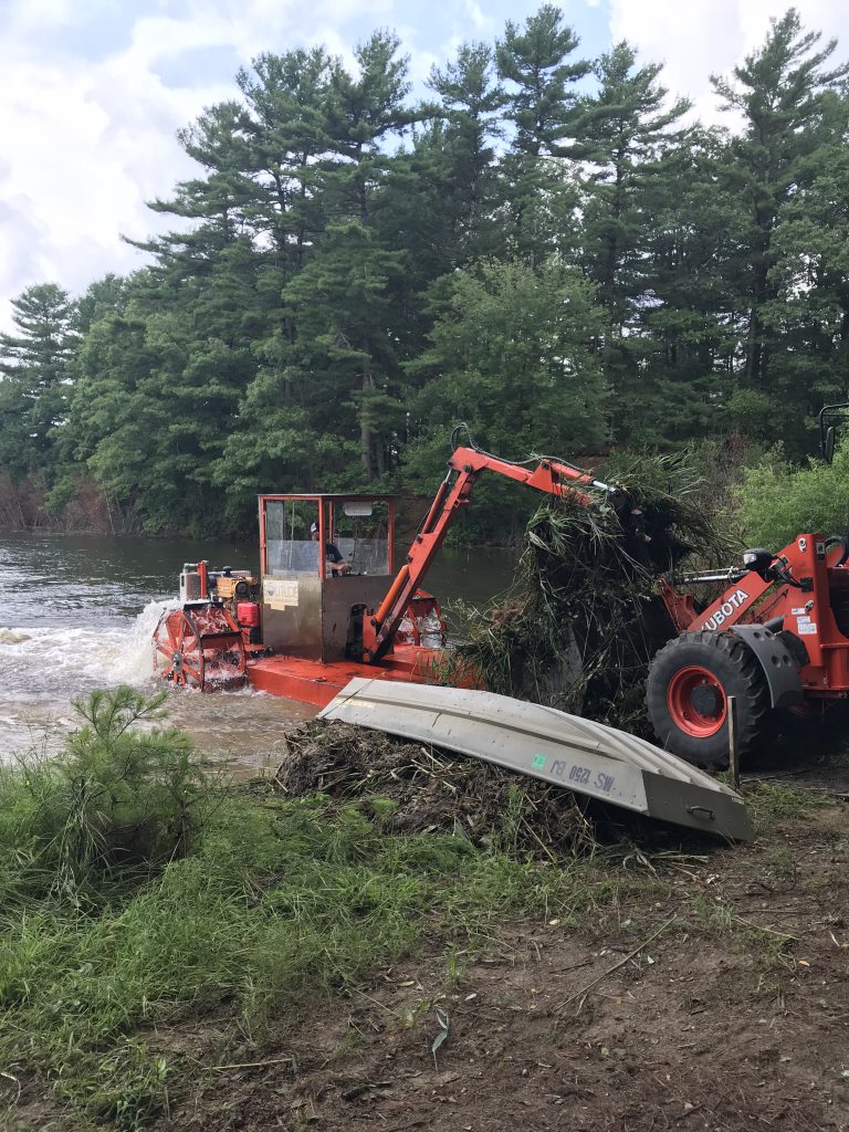 hydro-raking closeup - sediment removal services - invasive species removal