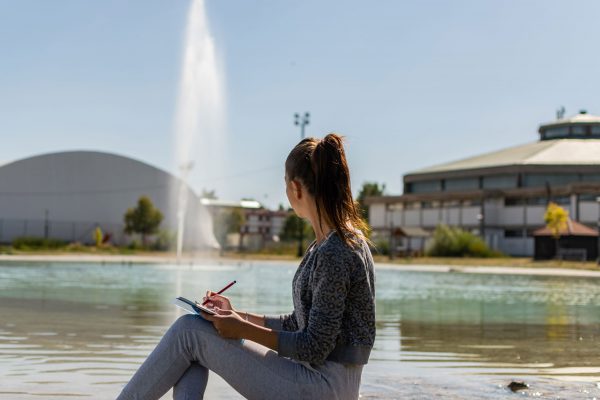 girl-enjoying-pond-lake-fountain