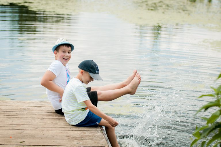 kids-playing-by-lake-pond