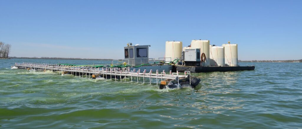 alum barge out on a lake applying an alum treatment