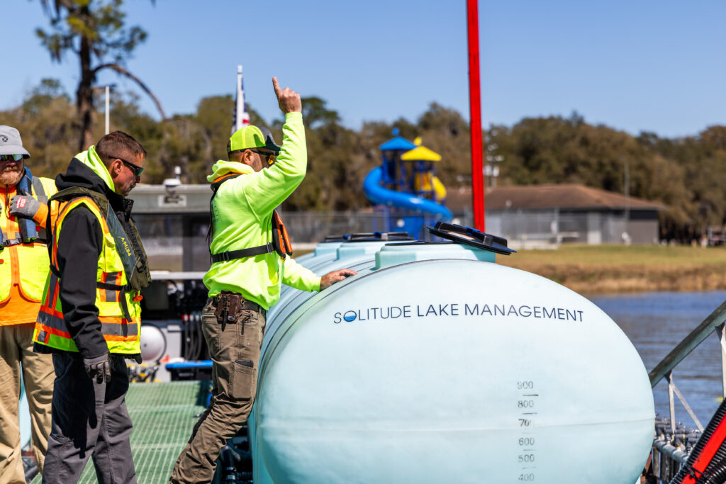 team-on-alum-barge-preparing-for-application