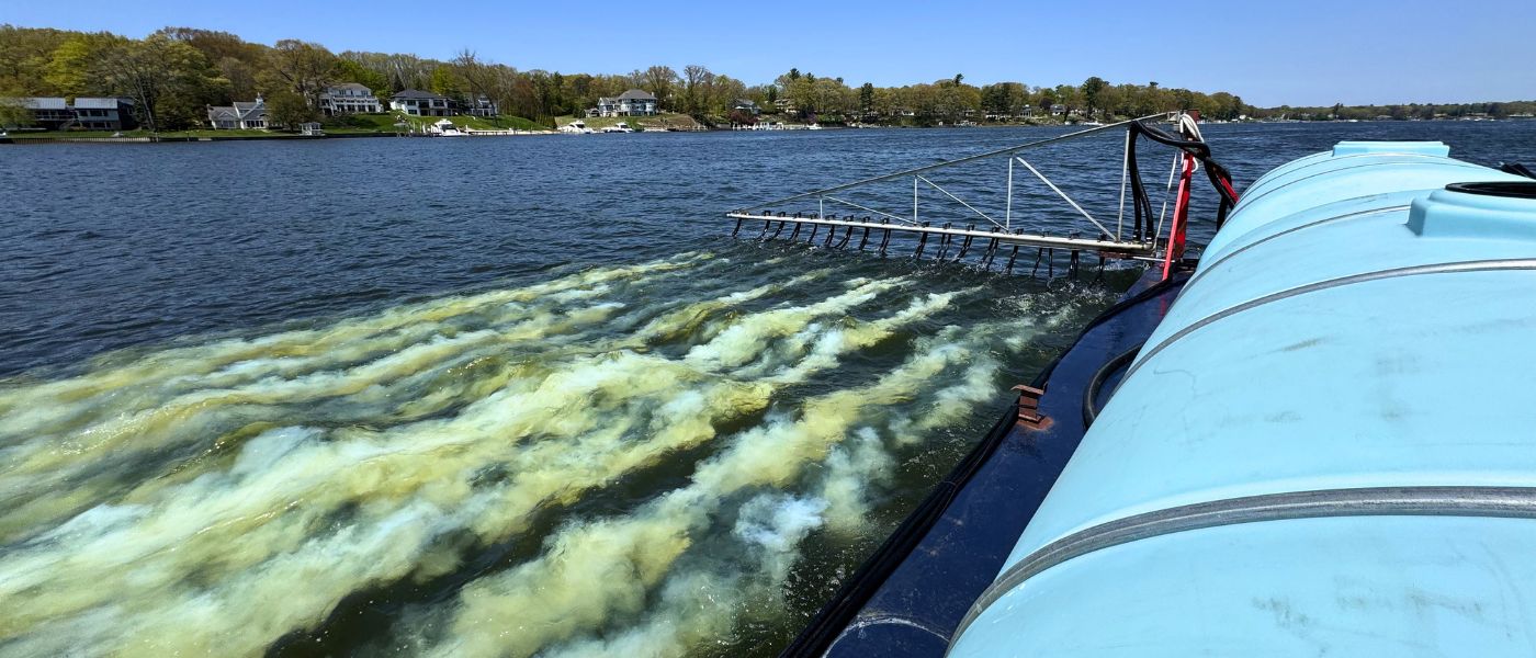 image of alum barge applying an alum treatment to the water nutrient management
