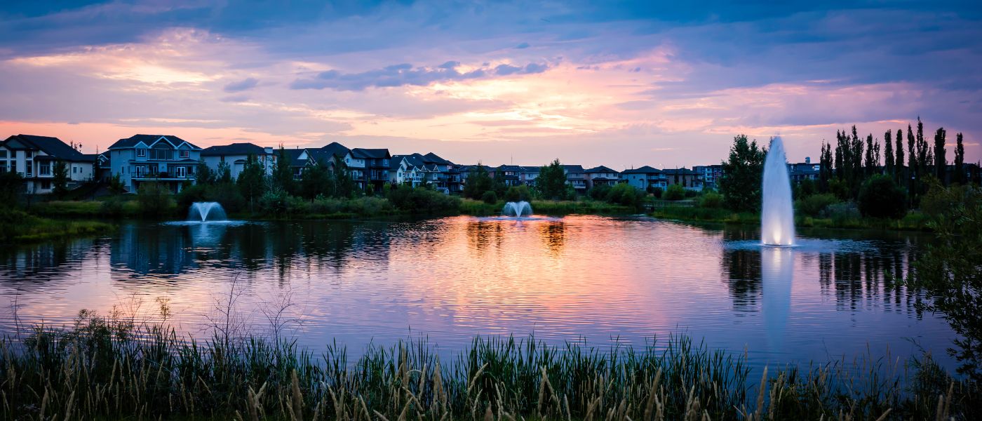 beautiful community lake with three floating fountain aeration systems